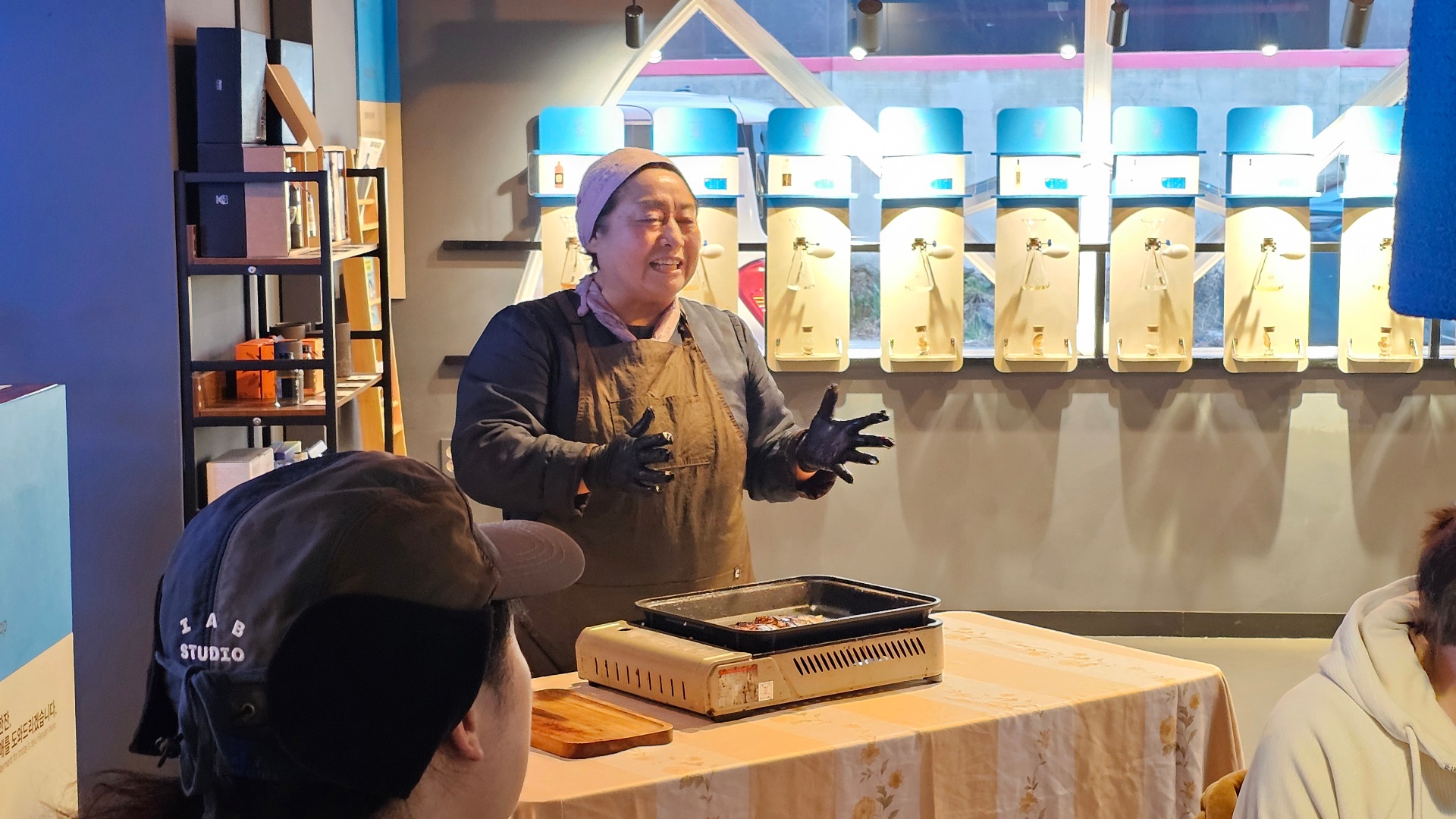 Local Jeju artisan presenting a tasting pairing with traditional sool