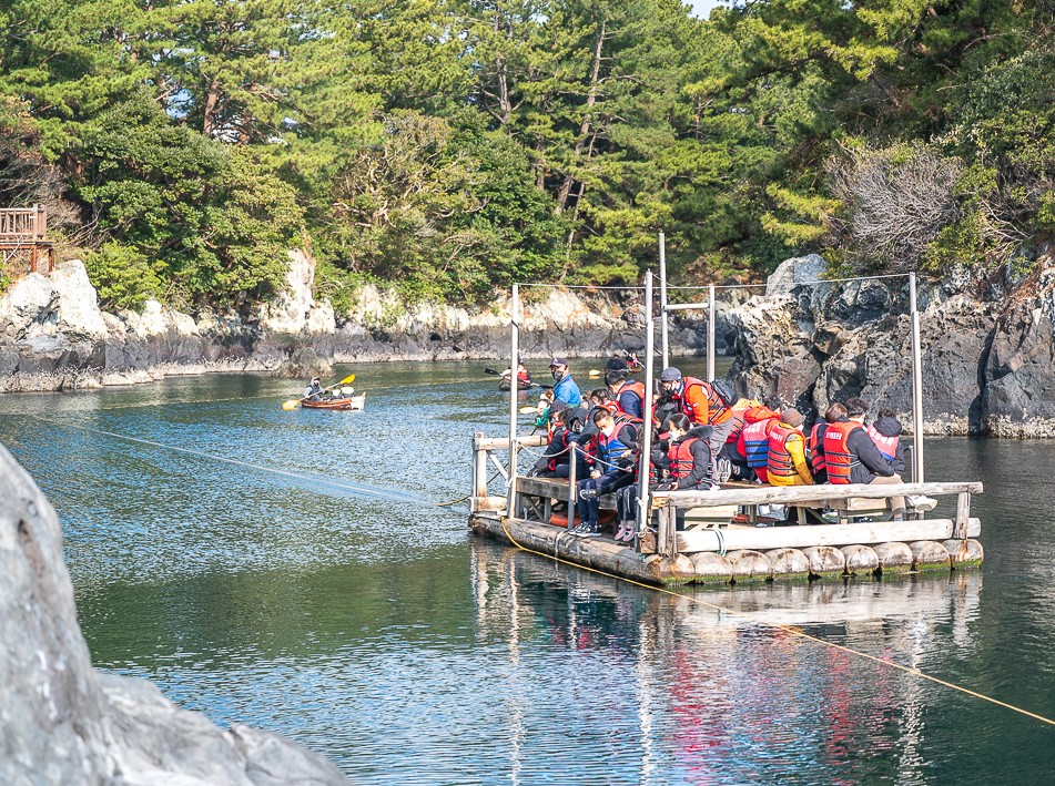 Traditional teu raft on the clear waters of Soesokkak, Jeju Island