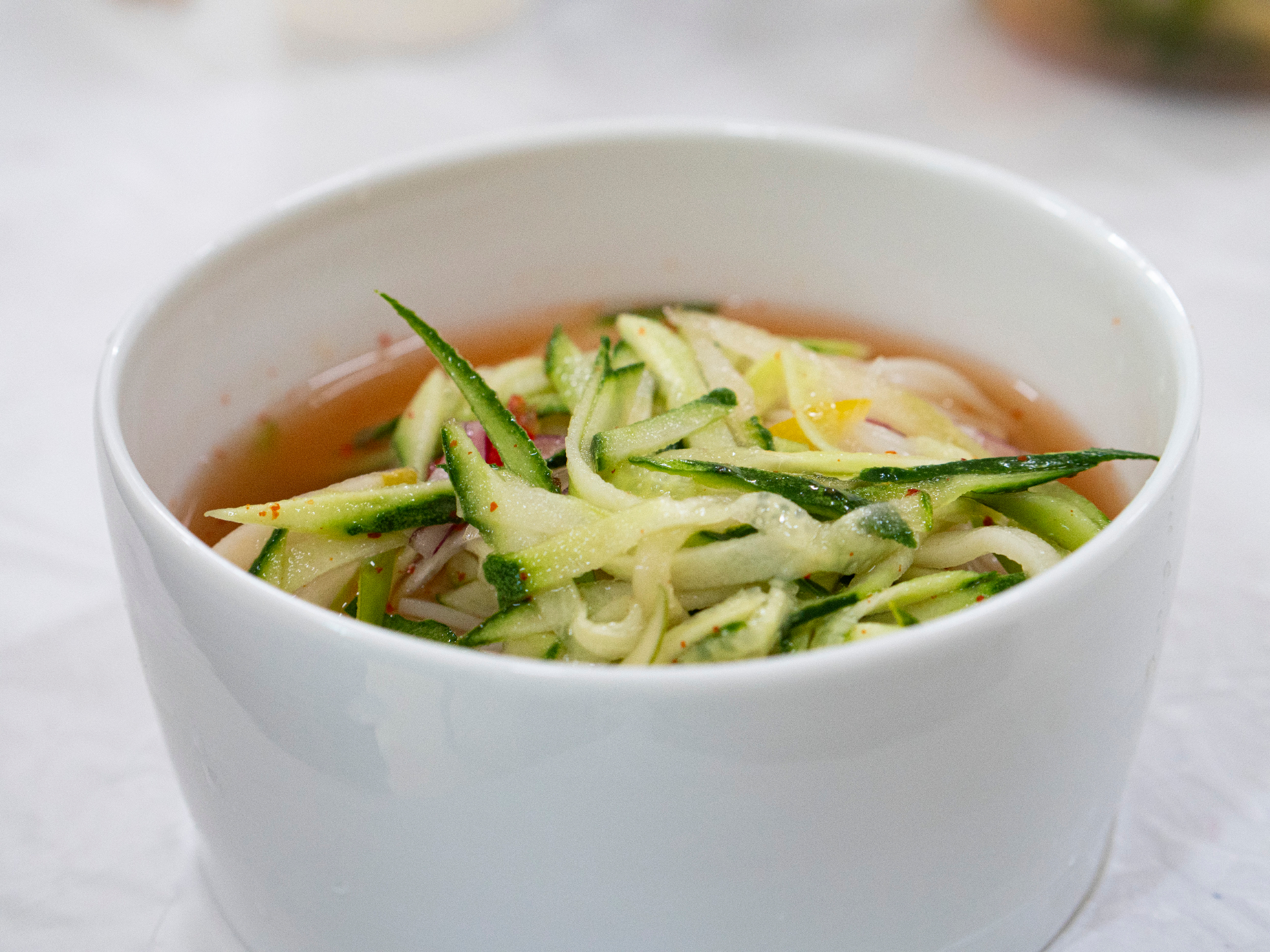 Traditional Korean vegetable soup served in ceramic bowl — authentic North Korean cuisine experience