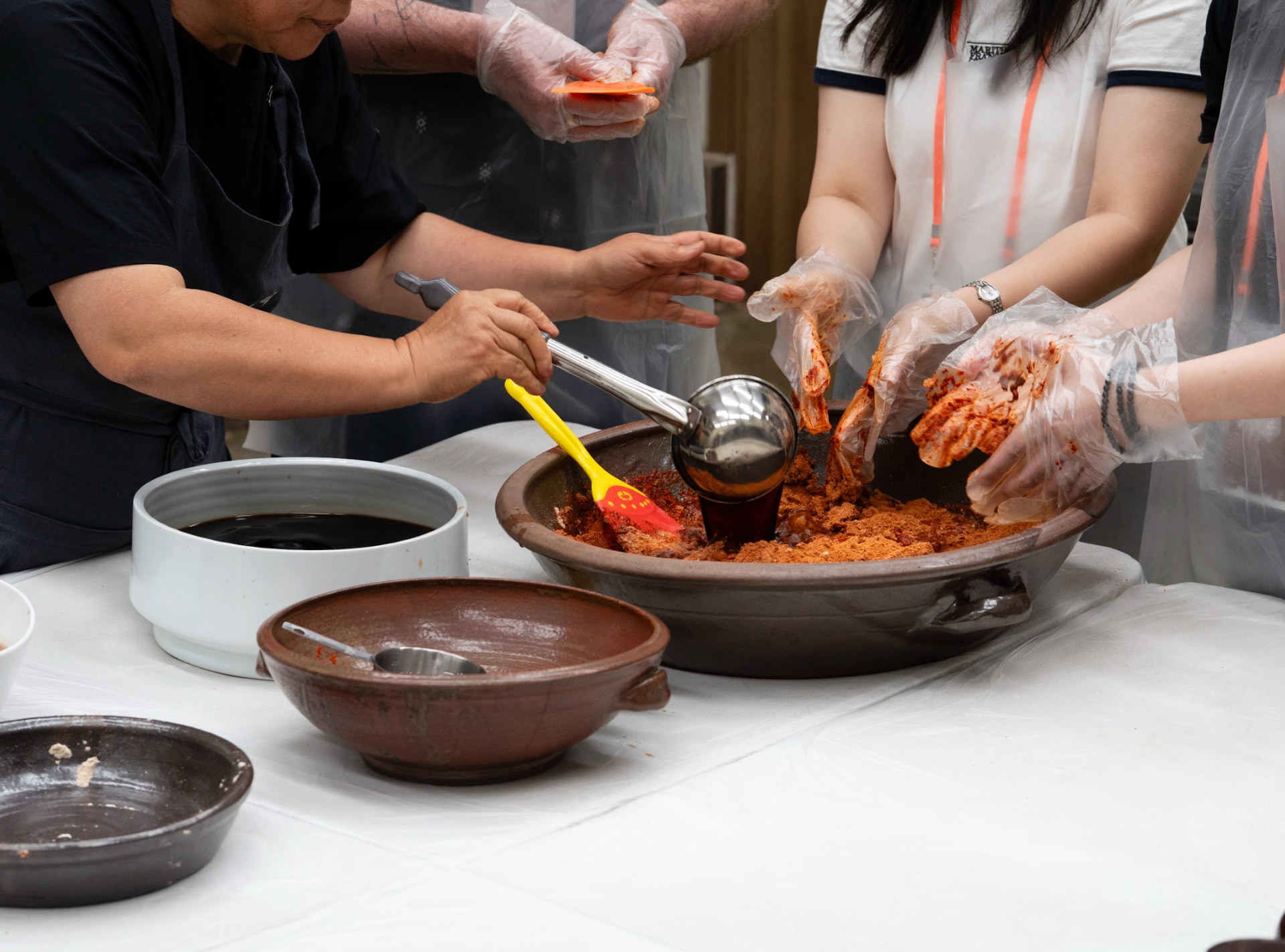 Intimate kimchi-making workshop with traditional ceramic vessels